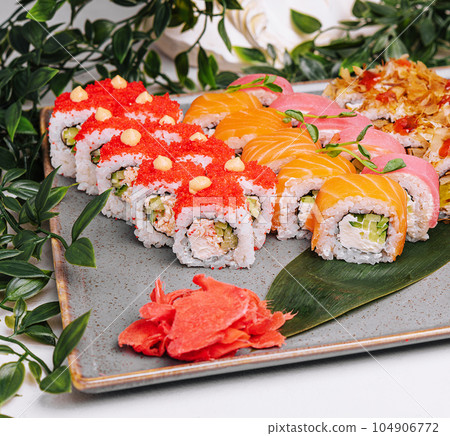 different sushi rolls on a big plate 104906772