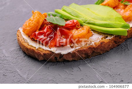Italian bruschetta with shrimp and avocado and tomatoes Italian bruschetta with shrimp and avocado and tomatoes 104906877