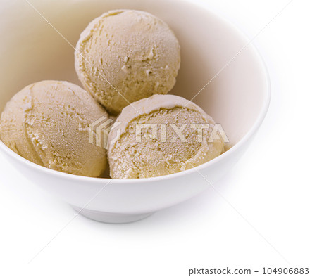 pistachio ice cream in white bowl 104906883