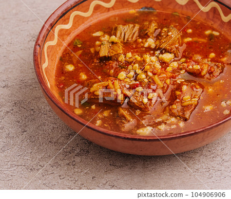 Spicy goulash soup with paprika on stone Spicy goulash soup with paprika on stone 104906906