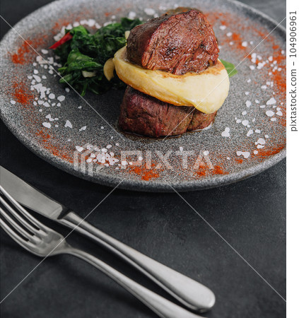 Filet mignon with mashed potatoes in a restaurant Filet mignon with mashed potatoes in a restaurant 104906961