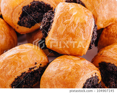 Tasty buns rolls with poppy filling on stone 104907145