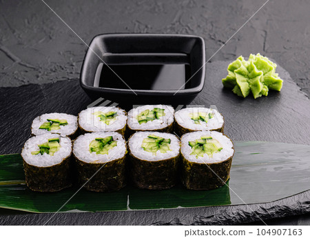 Sushi Maki rolls cucumber on stone Sushi Maki rolls cucumber on stone 104907163