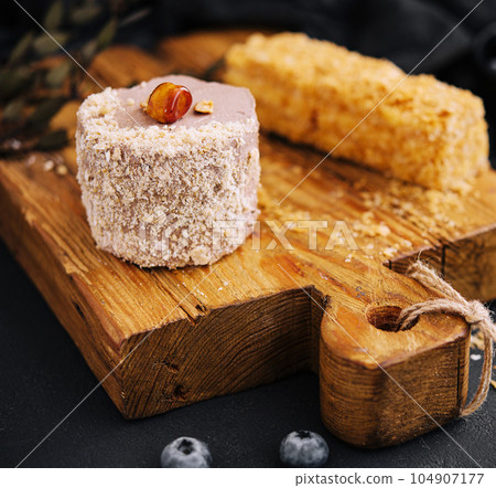 Kiev cake with Hazelnut and chocolate on board 104907177