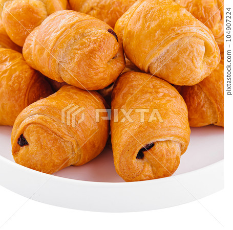 Tasty buns rolls with jam filling on plate 104907224