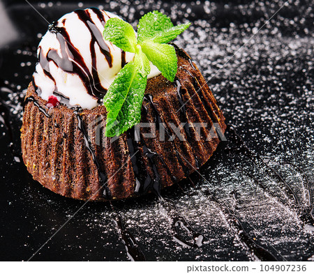 Chocolate brownie with vanilla ice cream Chocolate brownie with vanilla ice cream 104907236
