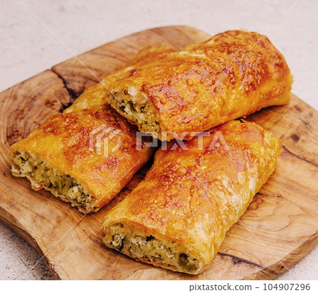 layered pastry with cottage cheese and herbs layered pastry with cottage cheese and herbs 104907296