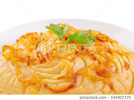 Mashed Potatoes with fried onions in plate 104907379