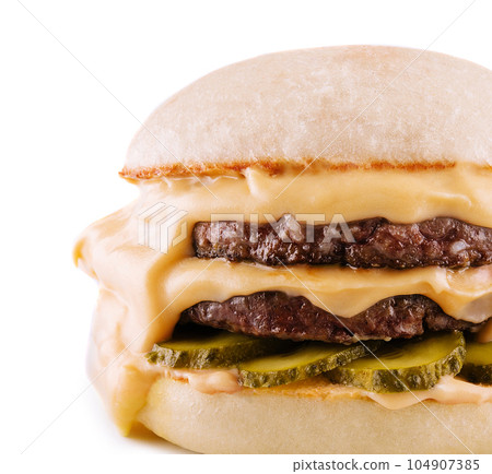 hamburger with two cutlets, pickled cucumbers and melted cheese hamburger with two cutlets, pickled cucumbers and melted cheese 104907385