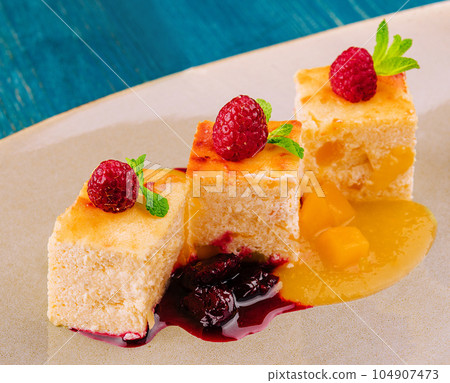 Piece of cottage cheese casserole with cherry jam Piece of cottage cheese casserole with cherry jam 104907473