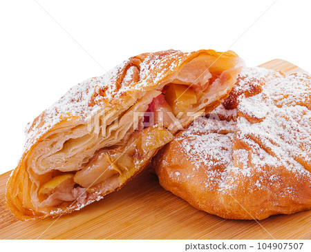 Baking puff pastry vertuta with apple or strudel 104907507