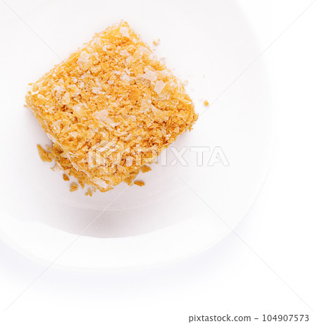 Slice of Napoleon Cake on top view 104907573