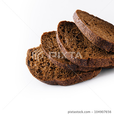 Cut loaf of rye bread isolated on white 104907656