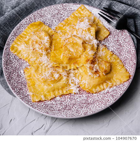 asian ravioli with chopsticks on plate 104907670