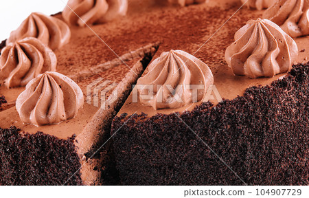 Chocolate Cake with Chocolate Fudge Drizzled Icing and Chocolate Curls 104907729