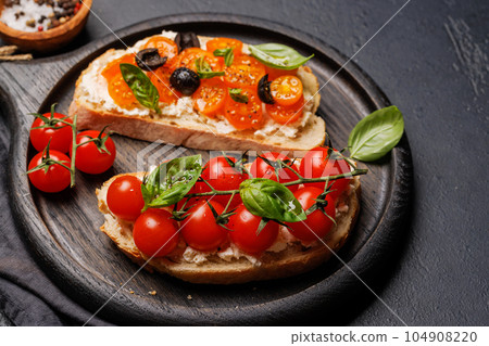 Sandwich set of bruschetta with juicy tomatoes, cheese and prosciutto Sandwich set of bruschetta with juicy tomatoes, cheese and prosciutto 104908220