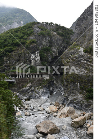 Vertical of the road tunnel on mountainside at Tianxiang Recreation Area in Xiulin Township, Taiwan. 104908803