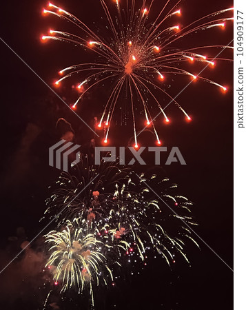 Night festive beautiful fireworks from different colors Night festive beautiful fireworks from different colors 104909177