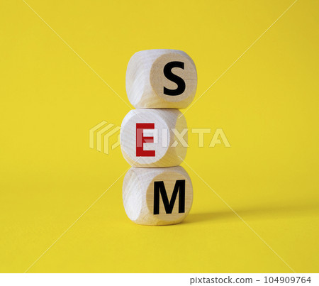 SEM - Search Engine Marketing symbol. Wooden cubes with words SEM. Beautiful yellow background. Business and SEM concept. Copy space. SEM - Search Engine Marketing symbol. Wooden cubes with words SEM. Beautiful yellow background. Business and SEM concept. Copy space. 104909764