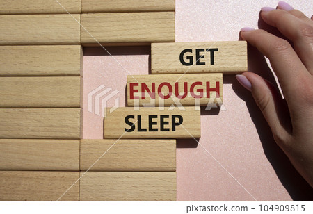 Get enough sleep symbol. Wooden blocks with words Get enough sleep. Beautiful pink background. Doctors hand. Healthy lifestyle, medical and Get enough sleep concept. Copy space. Get enough sleep symbol. Wooden blocks with words Get enough sleep. Beautiful pink background. Doctors hand. Healthy lifestyle, medical and Get enough sleep concept. Copy space. 104909815