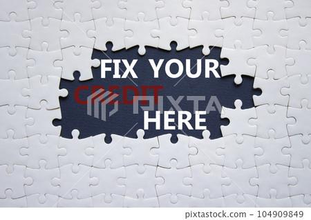 Fix your credit here symbol. Concept words Fix your credit here on white puzzle. Beautiful black background. Business and Fix your credit here concept. Copy space. 104909849