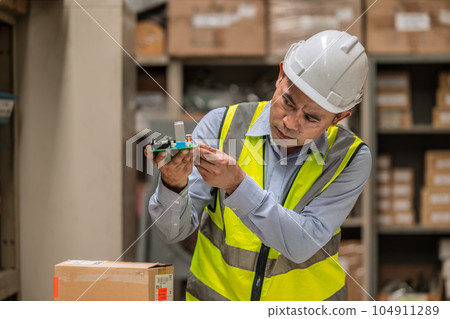 senior mananger products inspector quality control checking examination hardware electornics part before shipping or receiving in inventory store collection 104911289