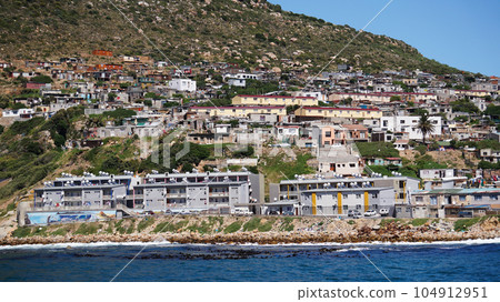 Local South African township housing residence area around Hout Bay hill side landscape from ocean Local South African township housing residence area around Hout Bay hill side landscape from ocean 104912951