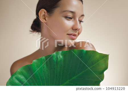 Skin Care Beauty Treatments Concept With Beauty Spa Woman Behind Green Leaf 104913220