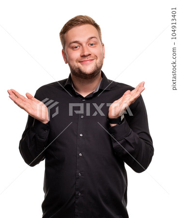 Handsome man in a black shirt, isolated on a white background, feeling great and comfortable. Handsome man in a black shirt, isolated on a white background, feeling great and comfortable. 104913401