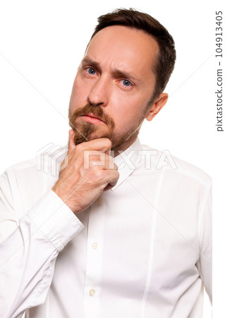 Handsome bearded man in a white shirt poses, isolated on a white background 104913405