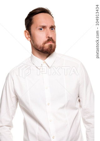 Handsome bearded man in a white shirt poses, isolated on a white background 104913434