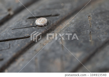 Rusty nail in flat tyre Rusty nail in flat tyre 104913540