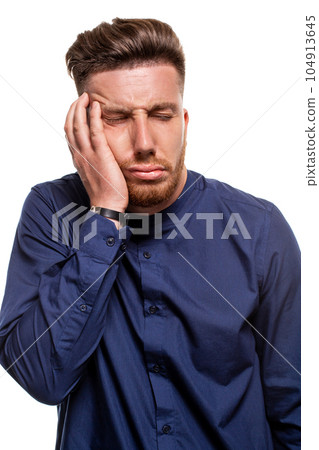 Attractive young man wearing blue shirt, isolated over a white background. Attractive young man wearing blue shirt, isolated over a white background. 104913645