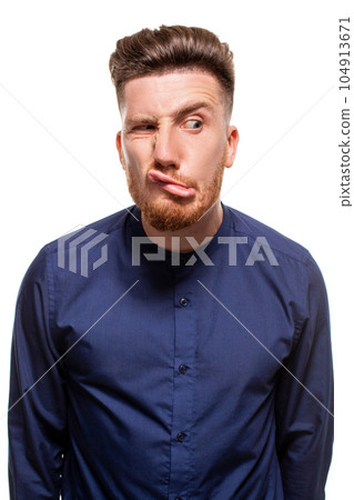 Attractive young man wearing blue shirt, isolated over a white background. Attractive young man wearing blue shirt, isolated over a white background. 104913671