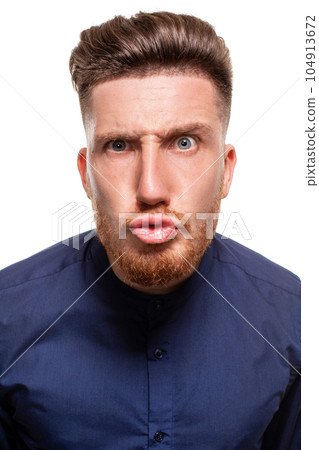 Attractive young man wearing blue shirt, isolated over a white background. 104913672