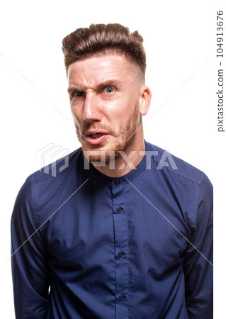 Attractive young man wearing blue shirt, isolated over a white background. Attractive young man wearing blue shirt, isolated over a white background. 104913676