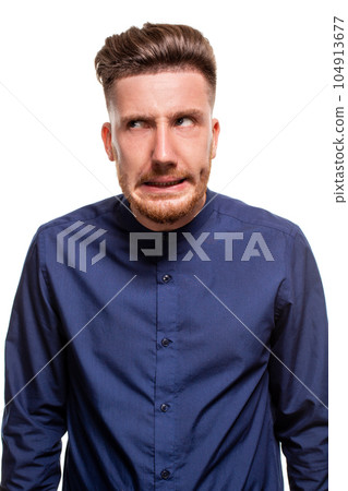 Attractive young man wearing blue shirt, isolated over a white background. Attractive young man wearing blue shirt, isolated over a white background. 104913677