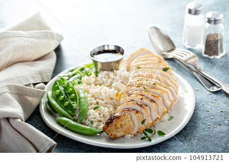 Grilled chicken with rice and peas Grilled chicken with rice and peas 104913721