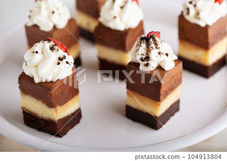 Bite sized dessert, three chocolates cake Bite sized dessert, three chocolates cake 104913804