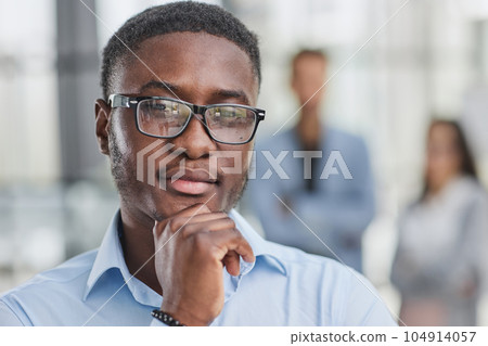 Pensive mixed race confident international company employee manager thinking of problem solution at office. 104914057
