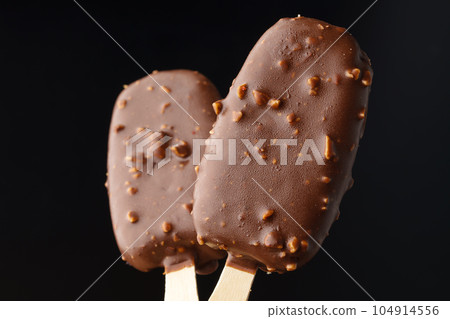 Chocolate cake pops ice cream on black background Chocolate cake pops ice cream on black background 104914556