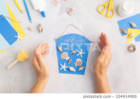 Paper bucket of shells summer idea for kids craft in kindergarten hands ocean's day Paper bucket of shells summer idea for kids craft in kindergarten hands ocean's day 104914900