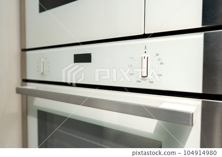New ovens in household appliance section in store New ovens in household appliance section in store 104914980