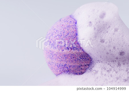 Pink bath bomb with soap on white background closeup. Sea salt in a ball shape for beauty spa treatment and body care. Pink bath bomb with soap on white background closeup. Sea salt in a ball shape for beauty spa treatment and body care. 104914999