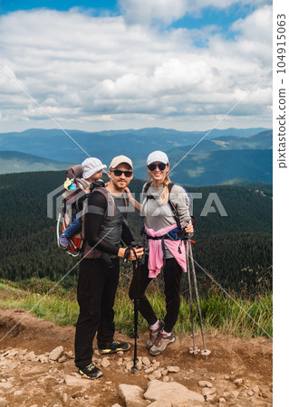 A family with a baby in the mountains A family with a baby in the mountains 104915063