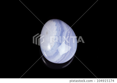 Macro mineral stone blue agate on black background Macro mineral stone blue agate on black background 104915174
