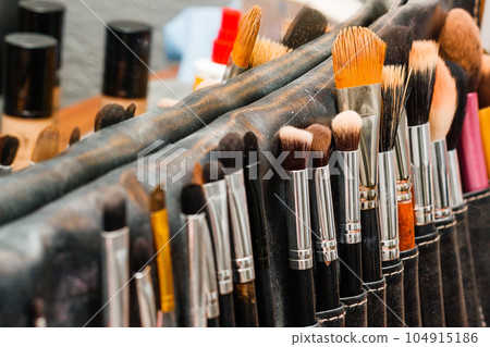 Cosmetics and make-up brushes Cosmetics and make-up brushes 104915186