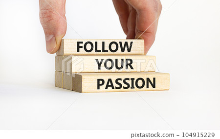 Follow your passion symbol. Concept words Follow your passion on blocks on beautiful white table white background. Businessman hand. Business, motivation and follow your passion concept. Copy space. 104915229