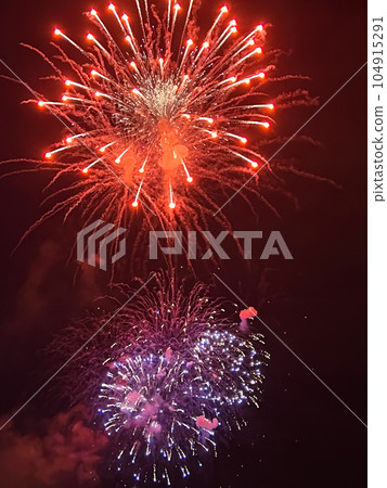 Night festive beautiful fireworks from different colors Night festive beautiful fireworks from different colors 104915291