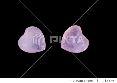 Macro mineral stone Heart pink quartz on a black background 104915326